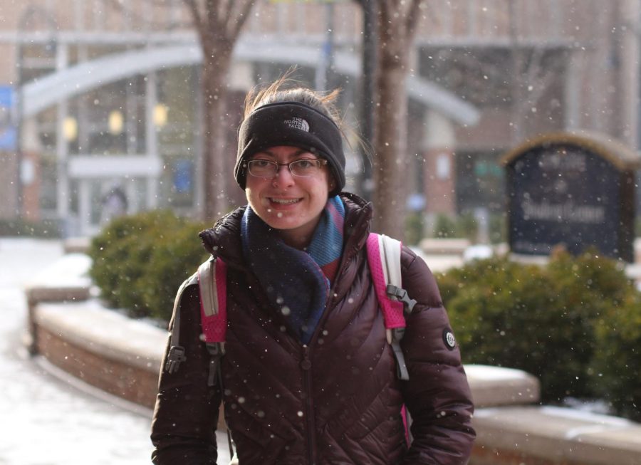 Freshman psychology major Casey Blum tries to stay warm with a scarf and headband while walking to class in the 7 degree weather on Tuesday, Jan. 19, 2015.