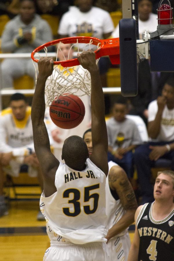 Redshirt junior forward Jimmy Hall throws down a dunk in the MACC Tuesday, Feb. 16, 2016. The Flashes beat Western Michigan University 85-78 in overtime.