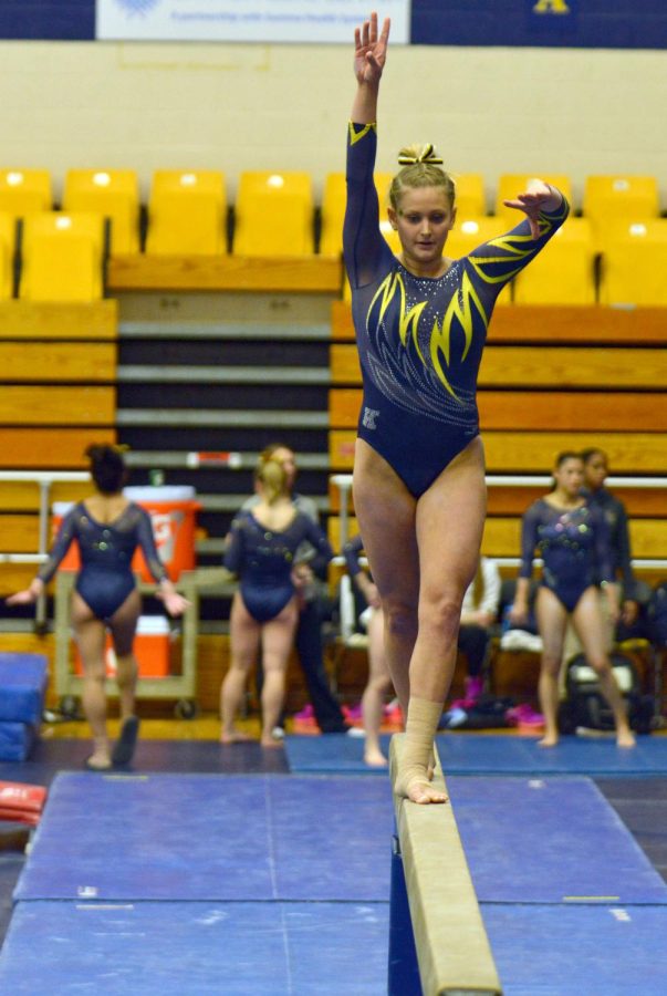 Sophomore Rachel Stypinski performs her balance beam routine in the M.A.C. Center on Sunday, Feb. 7, 2016.