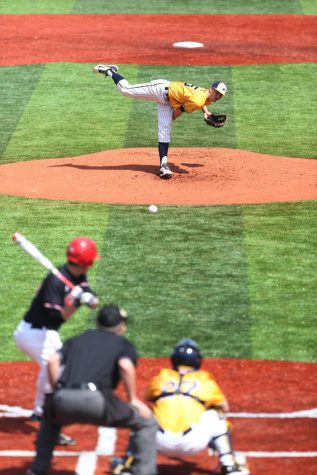 Sophomore Pitcher Andy Ravel pitching a ball against a Ball State University batter. The Flashes won 11 to 7. April 12, 2015.