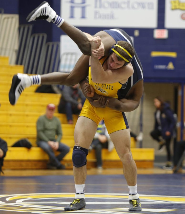 Kent State fifth year wrestler Tyler Buckwalter flips a wrester from Old Dominion University during a meet at the MACC on Jan. 24, 2016. The Flashes won the Meet 25-13.