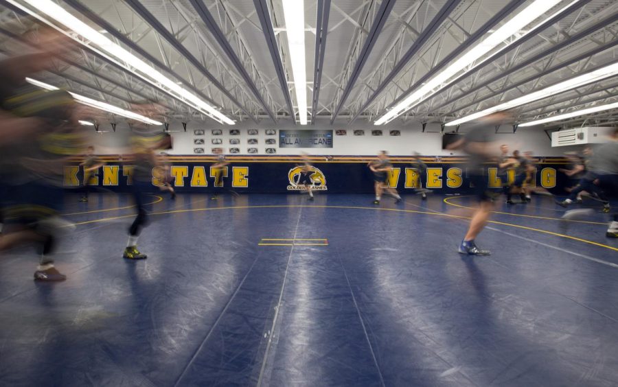 The Kent State wrestling team jogs at the start of practice in the M.A.C. Annex on Tuesday, Feb. 2, 2016. The Flashes will take on Central Michigan University on Sunday, Feb. 14, 2016.