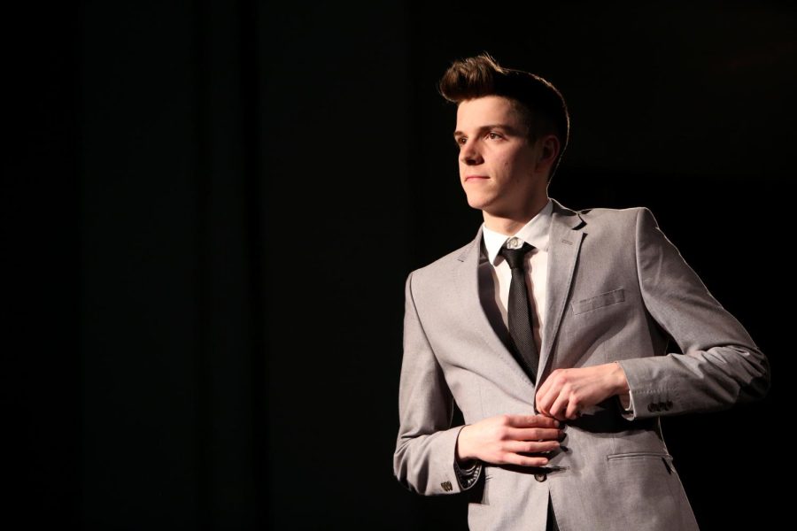 A model walks the runway at the For the Love of Fashion fashion show Feb. 13, 2015. The show was put on by College Town Kent and held in the Kent State University Hotel and Conference Center.