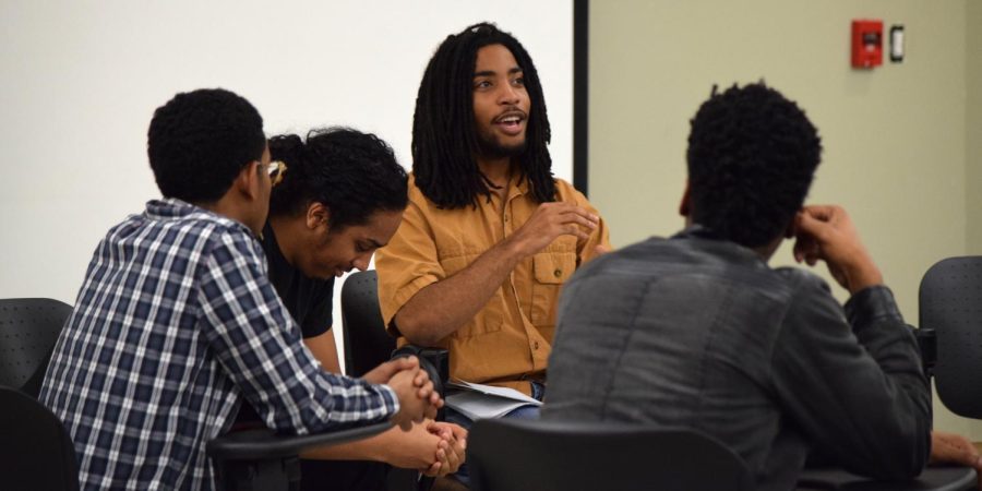 Junior entrepreneurship major John K.K. Jones leads the L.O.C.K.S. group in a discussion about African ancestry in Oscar Ritchie Hall room 214 on Tuesday, Feb. 2, 2016.