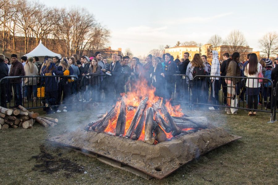 Students stand around the bonfire held in Manchester Field after the official announcement of Kent States rebranding on Monday Feb. 1, 2016.