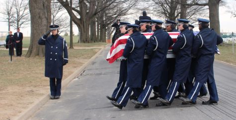 U.S. Air Force members carry Dale Kissinger’s casket to his burial site on Wednesday, Jan. 20, 2016.