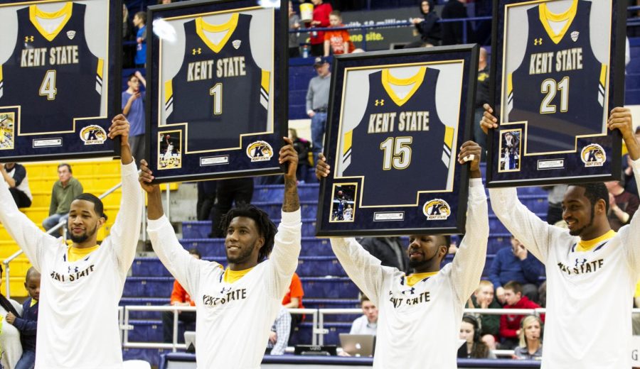 The graduating class for the Kent State men’s basketball team hold up their commemorative plaques on Senior Night before the game with Bowling Green. Tuesday, Mar. 1, 2016 at the MAC Center.