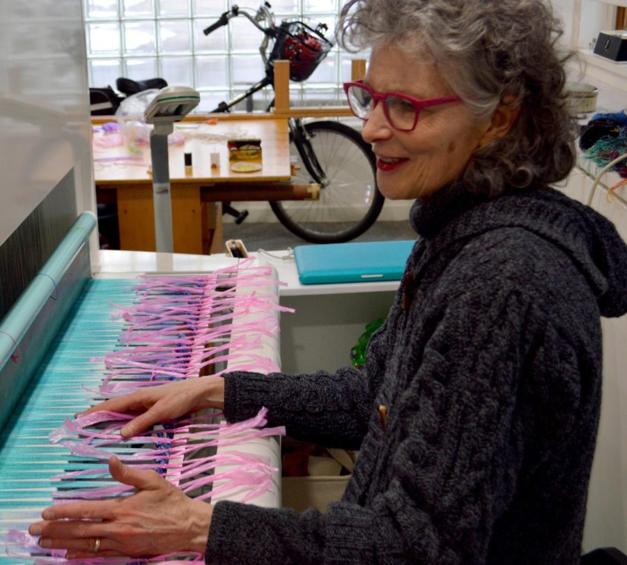 Janice+Lessman-Moss%2C+Textile+Professor+in+the+School+of+Art+at+Kent+State%2C+sits+at+her+loom+from+Norway+while+discussing+the+coming+Textile+Art+Open+House+on+Friday%2C+March+4%2C+2016.+Lessman-Moss+was+recently+named+an+%E2%80%9Cindividual+artist%E2%80%9D+category+winner+for+the+2016+Governor%E2%80%99s+Award%C2%A0for+the+Arts+in+Ohio.