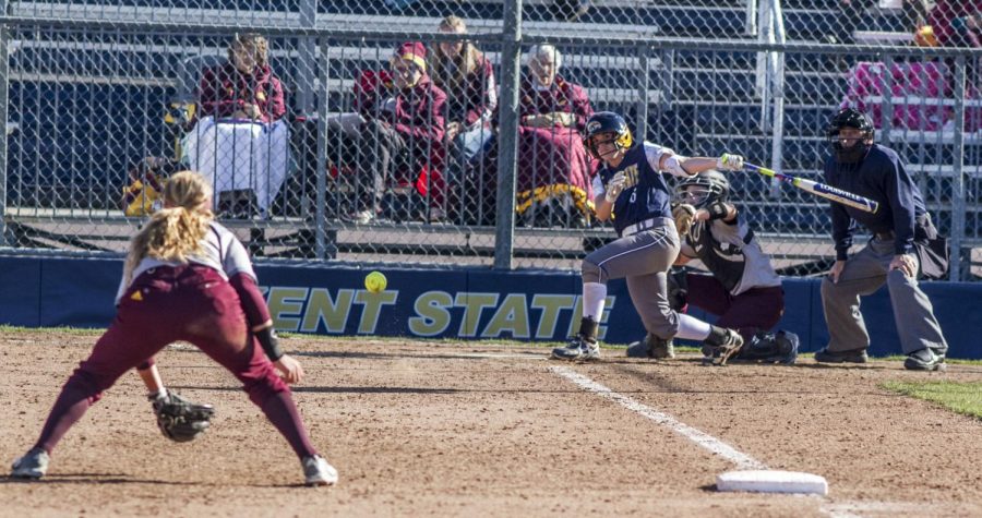Senior Arika Roush hits a grounder toward third base against Central Michigan University on Saturday, March 26, 2016 at the Diamond at Dix. Kent State shut out Central Michigan in both games of their double-header, 4-0 and 9-0.