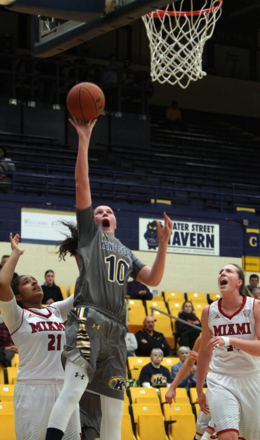 Redshirt sophomore forward McKenna Stephens reaches to make a basket in a basketball game against the Miami University Redhawks in the M.A.C. Center on Wednesday, March 2, 2016. The Flashes beat the Redhawks 59-53 in the last home game of the season.