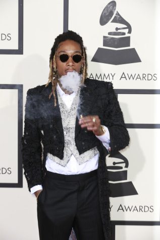 Wiz Khalifa arrives at the 58th Annual Grammy Awards on Monday, Feb. 15, 2016, at the Staples Center in Los Angeles. 