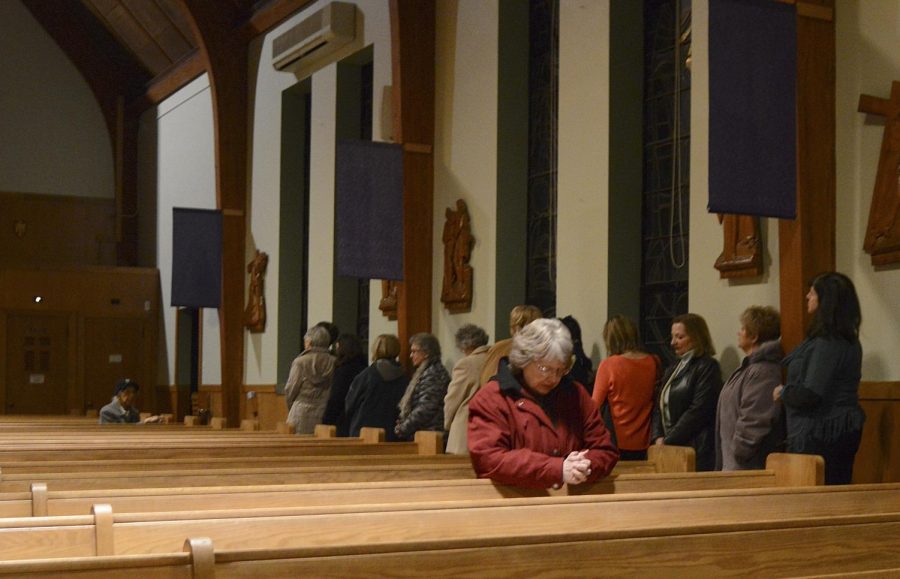 Members of St. Patrick’s Church in Kent, Ohio wait in line for confession on Wednesday, Mar. 2, 2016.