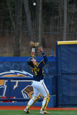 Sophomore catcher Tim DalPorto catches a pop fly hit by a player from Youngstown State University on Wednesday, April 13, 2016. The Flashes won 5-2.