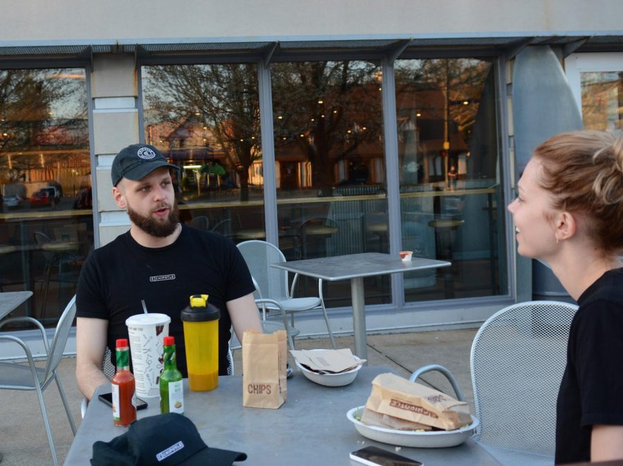 Freshman biology major, Carly Perkowski and senior applied engineering major, Paul Crisafi relax and enjoy their meal in the warm weather Saturday, April 16, 2016.