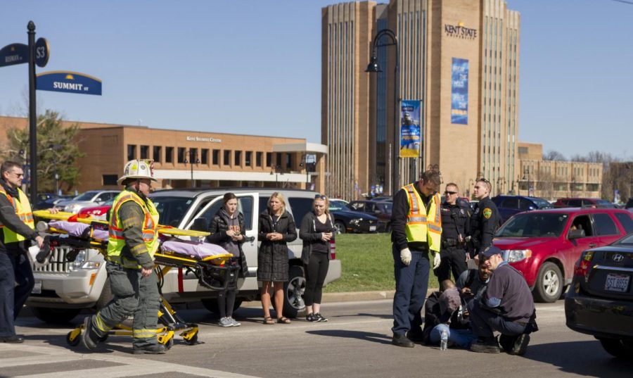 Emergency crews tend to Thirupathi Vakiti after he was struck by a car on East Summit Street near the Kent State Student Center on Tuesday, April 5, 2016.