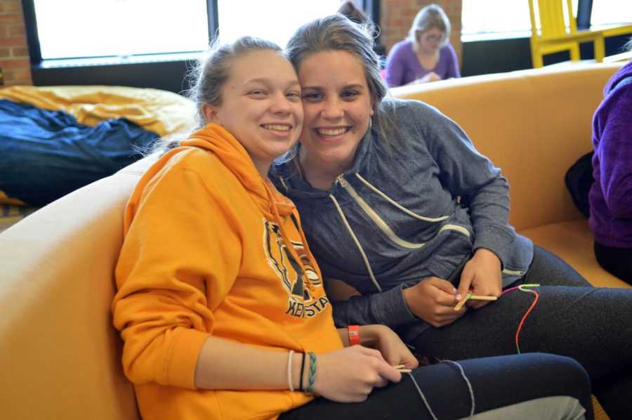 Sisters Megan and Briget Downey do crafts together for “Lil Sibs Weekend” in The Nest on April 10, 2015.