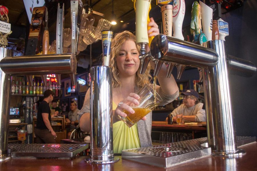 Savannah Freese, of Water Street Tavern, pours a beer on Friday, April 15, 2016.