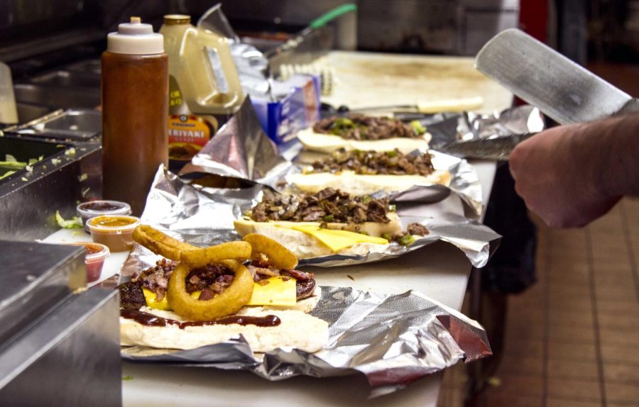 Cooks at Euro Gyro prepare food for the Friday late-night crowd on April 15, 2016.