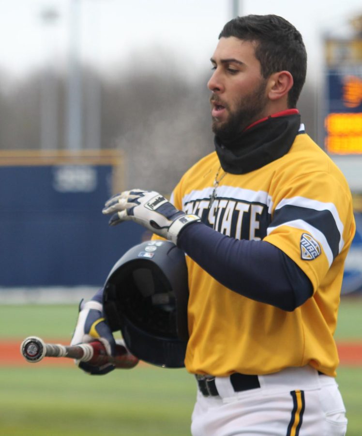 Junior Conner Simonetti walks off the field after hitting a home run in the first of two games against University of Toledo on Sunday, April 10, 2016. Kent State lost the first game 1-4.
