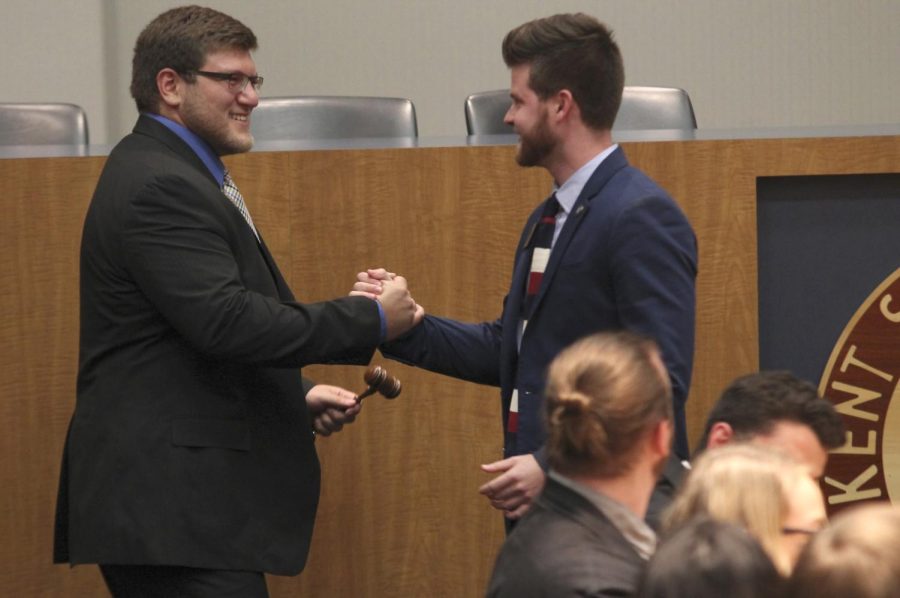 Undergraduate Student Government Executive Director Samuel Graska (left) shakes former Executive Director Brian Cannon’s hand (right) at the USG meeting on Thursday, April 27, 2016. Graska took over Cannon’s position for the 2016-2017 academic year.