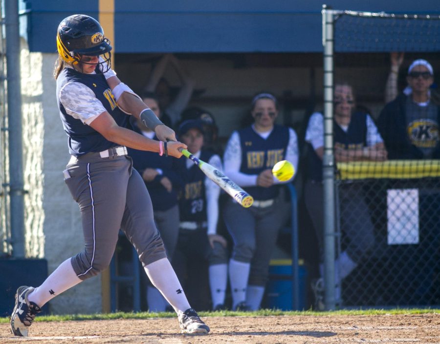 Senior catcher Erika Warren drives home a run with a base hit for the Kent State softball team. The Flashes won both games of the double-header against Central Michigan University at the Diamond at Dix, 4-0 and 9-0, on Saturday, March 26, 2016.