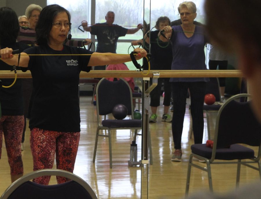 Lilian Kolodziej, the instructor, leads her SilverSneakers class in an exercise on Friday, April 29, 2016. The group meets every Friday morning for cardio and weight lifting workouts.