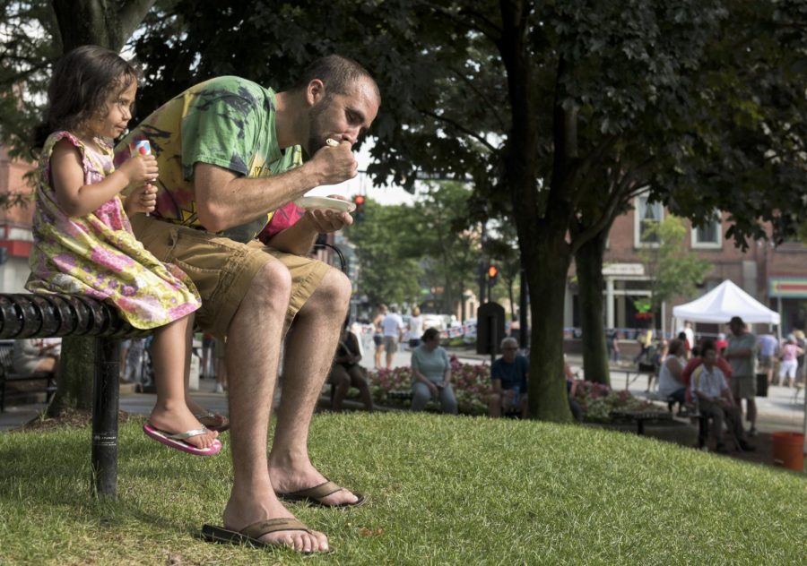 Kent resident Josh Wilkinson and his three-year-old daughter, Sophia, enjoy food and ice cream at the seventh annual Grill For Good fundraiser in the Hometown Bank Plaza on Saturday, June 11, 2016.