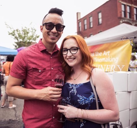 Ben and Jordan Thai of Akron, Ohio, enjoy the festivities at the 10th annual Kent Main Street Art and Wine Festival on Saturday, June 4, 2016.
