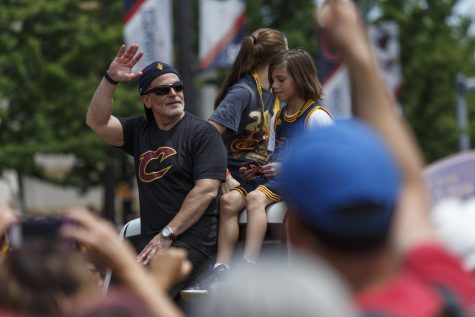 Daniel Gilbert, owner of the Cleveland Cavaliers, waves to fans as his float passes by during the teams NBA title victory parade in downtown Cleveland on Wednesday, June 22, 2016.