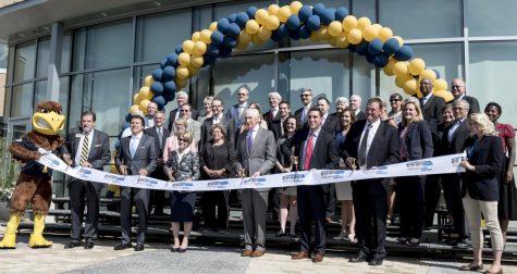 Kent State President Beverly Warren, as well as members of the Board of Trustees and the Foundation Board, cut the ribbon for the grand opening of the Center for Philanthropy and Alumni Engagement on Friday, June 3, 2016.