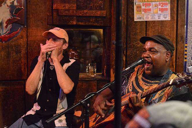 John Sutton, left, performs on his harmonica while vocalist Luther Sutton plays guitar at The Loft during Kent Blues Festival on July 17, 2015.