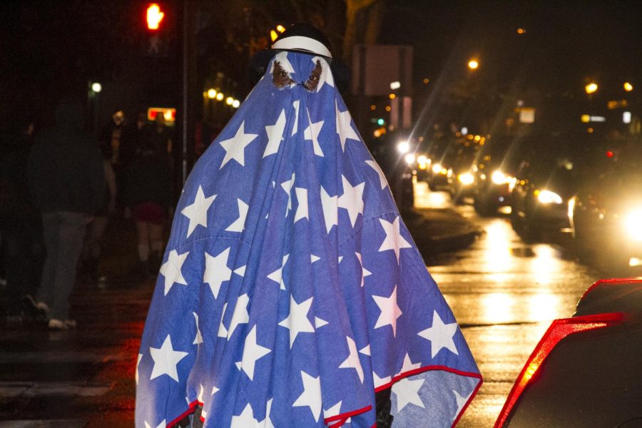 The ghost of America crosses downtown traffic during the Halloween festivities outside of the Zephyr Pub on Oct. 31, 2015.