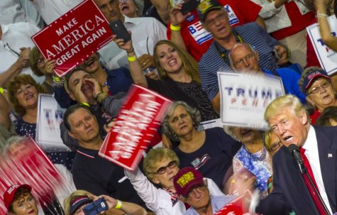 Supporters cheer as Republican presidential nominee Donald Trump speaks at the James A. Rhodes Arena in Akron, Ohio, on Monday, Aug. 22, 2016.