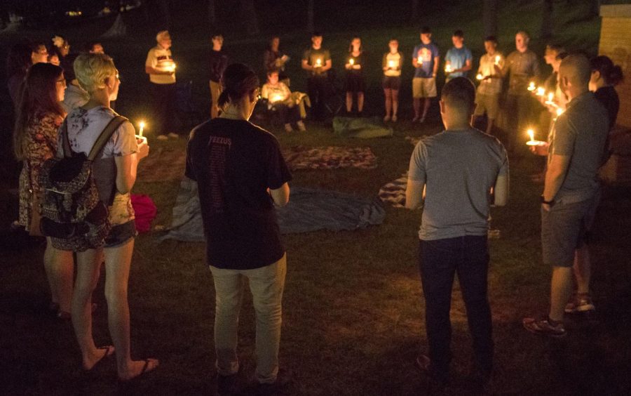 Mourners for Kent State student Jared Grieb tell stories and give prayers at the vigil held on Kent States Memorial Field on Tuesday Aug. 30, 2016.