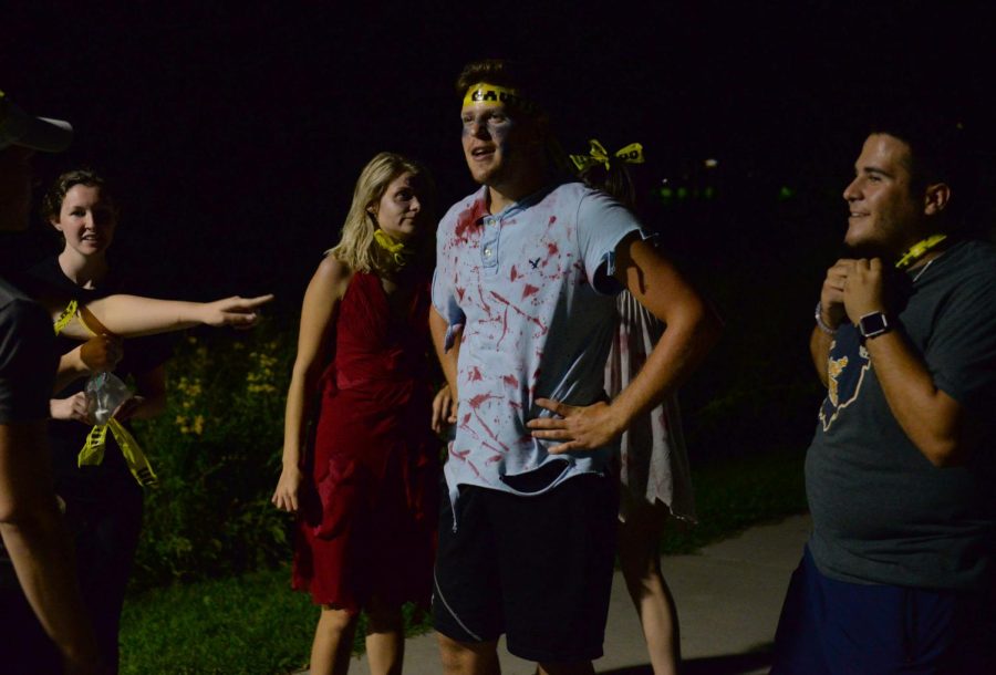A group of zombies catch their breath after chasing humans at the Kent NAVS Zombie Apocalypse event on campus on Friday, Sept. 2, 2016.