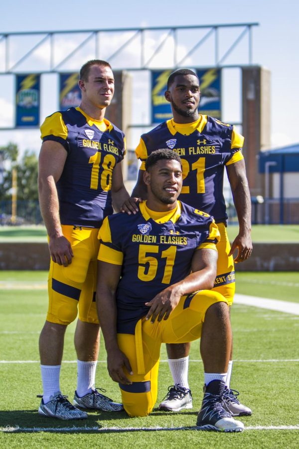Senior Nate Holley (#18), junior Demetrius Monday (#21) and senior Terrence Waugh (#51) pose for a picture at the Kent State football team’s media day at Dix Stadium on Sunday, Aug. 7, 2016.
