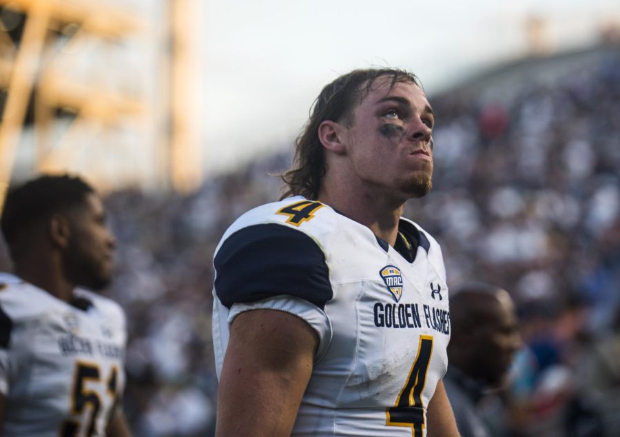 Junior wide receiver Nick Holley looks to the scoreboard in disappointment as the Flashes leave Beavers Stadium after losing to Penn State, 33-13 on Saturday, Sept. 3, 2016.