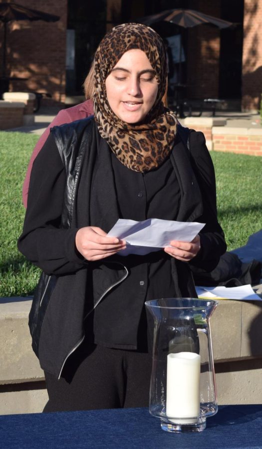 Junior chemistry major Lama Abu-Amara gives words of encouragement to the bystanders on Sun Sept 11, 2016. Lama is the president of the Muslim Student Association at Kent State. Kayla McMillen/ Kent Stater