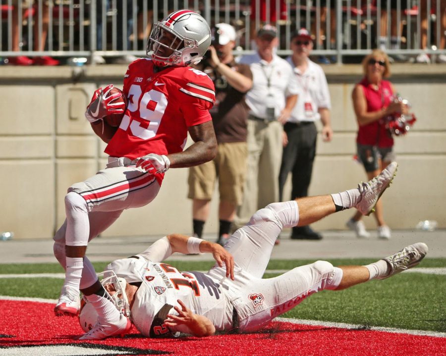 Barbara J. Perenic/Columbus Dispatch/TNS Ohio State defensive back Rodjay Burns (29) dances around Bowling Green Falcons defensive back Romeo Masuku (12) and into the end zone for a touchdown during the second half at Ohio Stadium in Columbus, Ohio, on Saturday, Sept. 3, 2016. Ohio State won, 77-10.