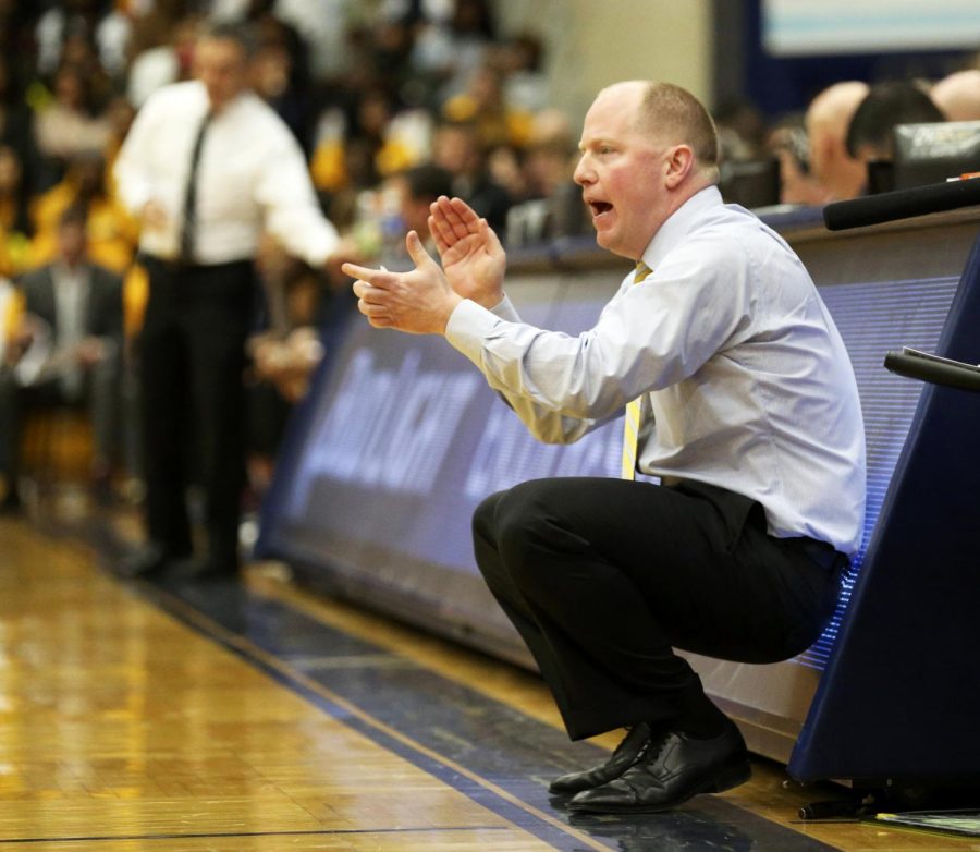 Kent State mens basketball head coach Rob Senderoff cheers on the Flashes against the University of Akron on Friday, Feb. 19, 2016 in Kent, Ohio, at the M.A.C. Center. The Golden Flashes won the game 85-76.
