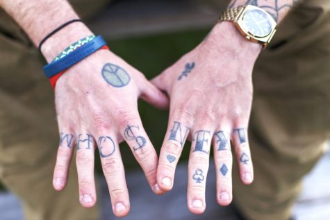 Jonny Szczesniak, 20, displays his “Whos Next” tattoo on Thursday, Oct. 13, 2016. 