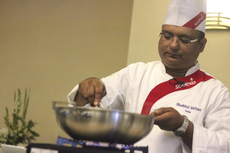 Chef Shobhit Mohan of Indian uses authentic Indian spices to show students how to cook Chicken Tikka Masala. He said sharing authentic cuisine with students through the Global Chef Program has been a rewarding experience.