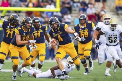 Junior running back Nick Holley started as quarterback for the Flashes against The University of Akron on Saturday, Oct. 1, 2016, at Dix Stadium. 
