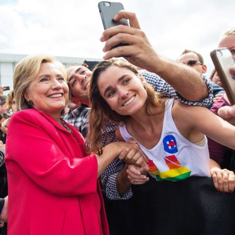 Beatrice Cahill-Camden, a junior international relations major, shakes Democratic presidential nominee Hillary Clinton’s hand. Cahill works on Clintons campaign as a Correspondence Intern, where her main duties involve connecting with voters.