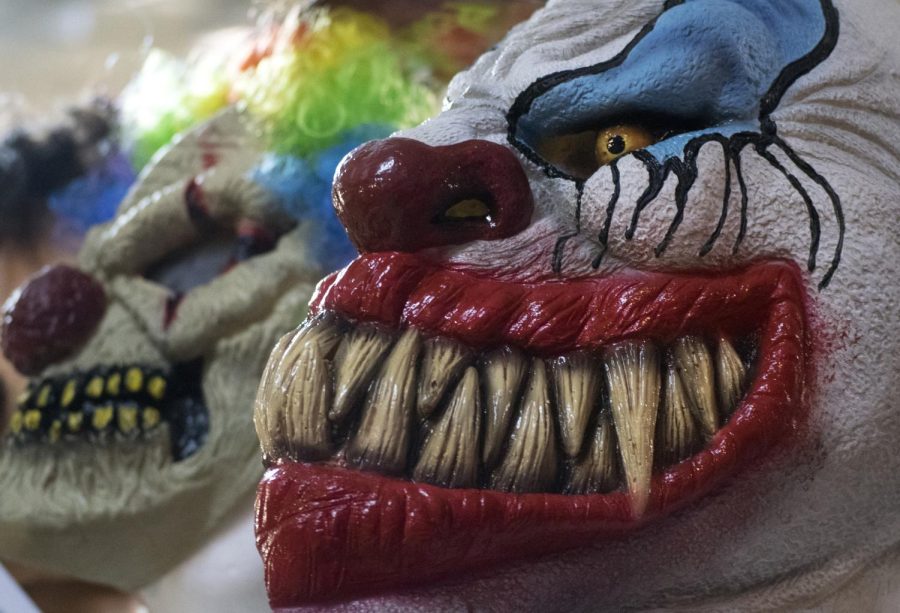 Clown masks sit idle on a shelf at Mr. Funs Costume & Magic Emporium in Cuyahoga Falls, Ohio, on Thursday, Oct. 26, 2016