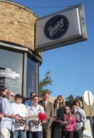 Kent City Manager David Ruller and owners of the newly-opened Erie Street Kitchen attend its grand opening and ribbon cutting at the Venice Cafe Wednesday, Oct. 12, 2015.