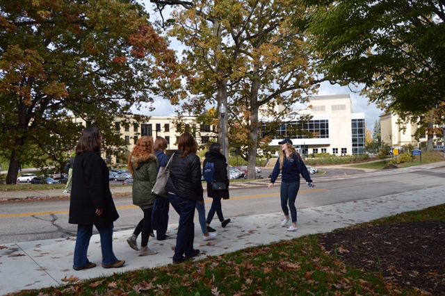 Senior fashion merchandising major Megan Fishburn gives prospective Kent State students and their families a tour of the universitys main campus.