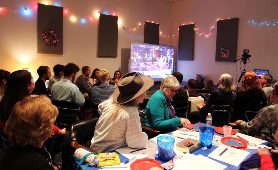 A crowd watches the election results come in during the first ever WKSU election night watch party. The event was created as a way to get the community involved with broadcasting and politics. ​