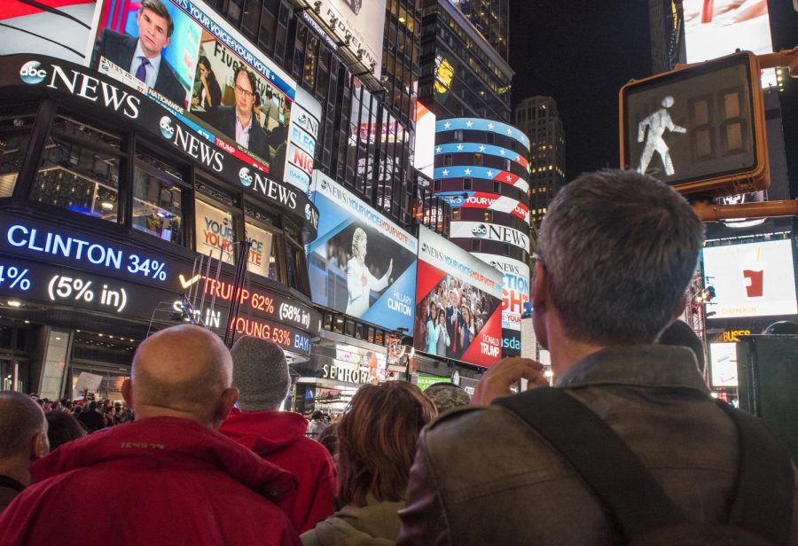 A large crowd watches the presidential election results from Times Square in New York City on Tuesday, Nov. 8, 2016. This is the first time in modern history that both major party candidates have come from the same state — New York.