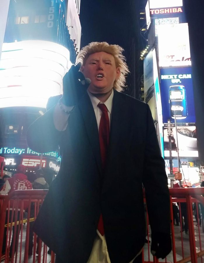 Austin Branton, a 20-year-old from Detroit, performs in the middle of Times Square Nov. 7, 2016, dressed as Republican presidential nominee Donald Trump.